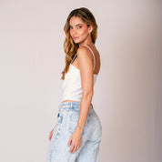 BLUSA AJUSTADA CORTA TIRAS TRUCO