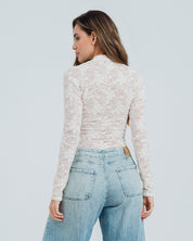 BLUSA AJUSTADA MANGA LARGA PLUNI