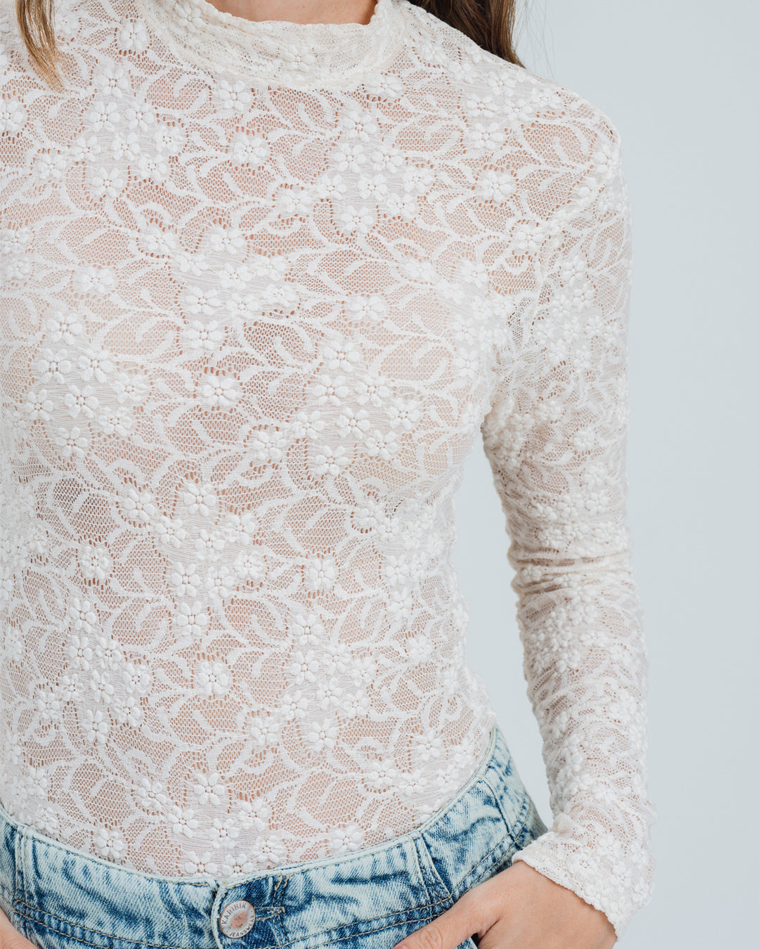 BLUSA AJUSTADA MANGA LARGA PLUNI