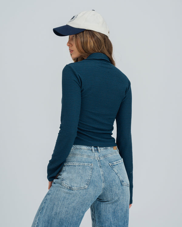 BLUSA AJUSTADA MANGA LARGA PLEIT